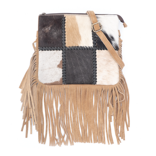 Crossbody schoudertas met patchwork koeienhuid en franjes