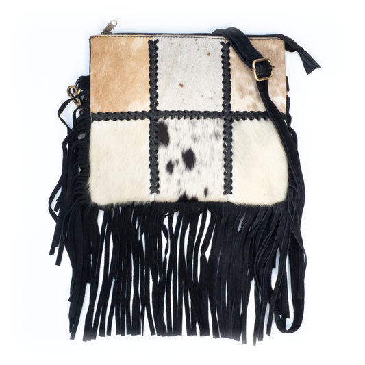 Crossbody schoudertas met patchwork koeienhuid en franjes